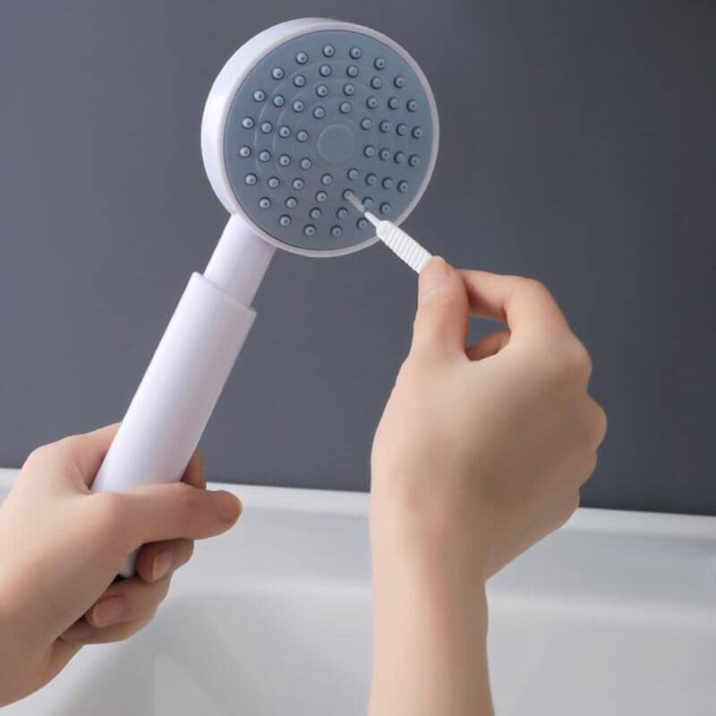 Shower hole cleaning brush nozzle